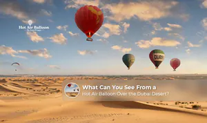 Hot air balloon flying over the Dubai desert at sunrise.