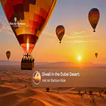 A hot air balloon floating over the Dubai desert during a festive Diwali sunrise experience.