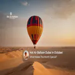 Hot air balloon floating above the Dubai desert during a peaceful October morning.