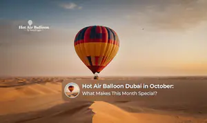 Hot air balloon floating above the Dubai desert during a peaceful October morning.