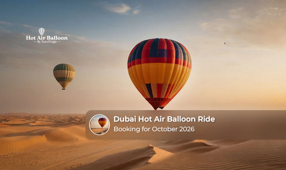 Hot air balloon floating above the Dubai desert during an October sunrise.