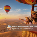 Family enjoying a hot air balloon flight over the Dubai desert at sunrise.