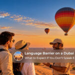 Tourists listening to a hot air balloon pilot explain flight instructions before takeoff in Dubai.
